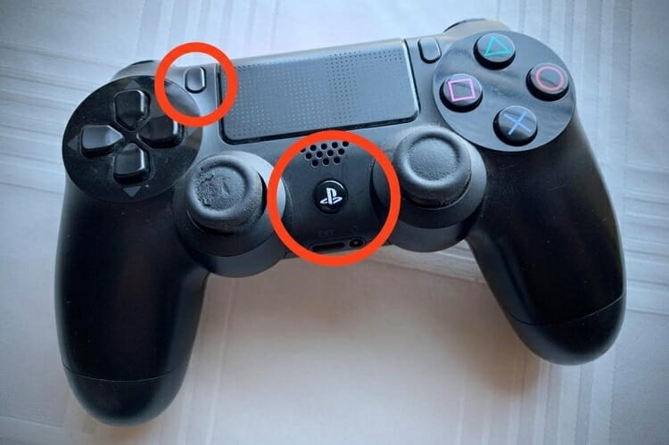 the flashlight on the back of the DualShock 4 controller will turn to a reddish-pink color